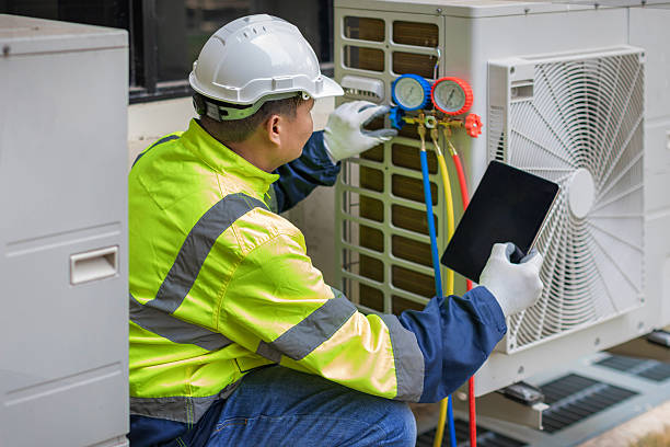 Professional Air Conditioning Repair technician working in Cedar Springs, MI